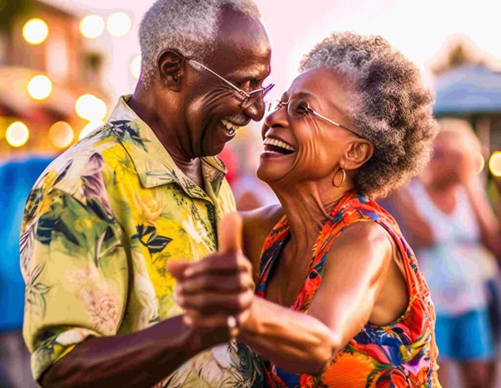 Senior couple happily dances on boardwalk.